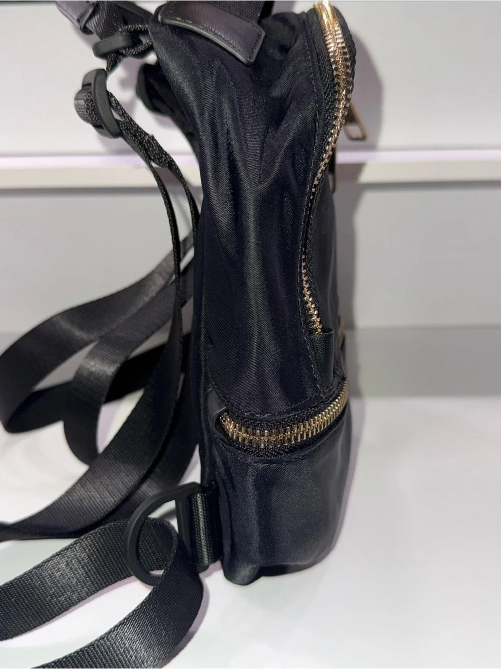 lululemon athletica Black Mini Backpack with Gold Zippers